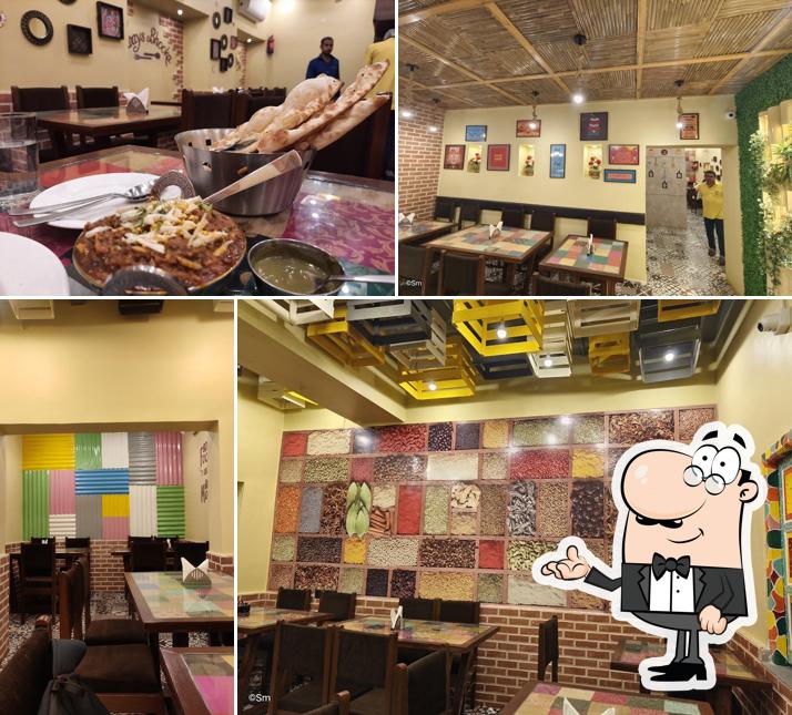 Take a seat at one of the tables at Oye Balle Balle Dhaba