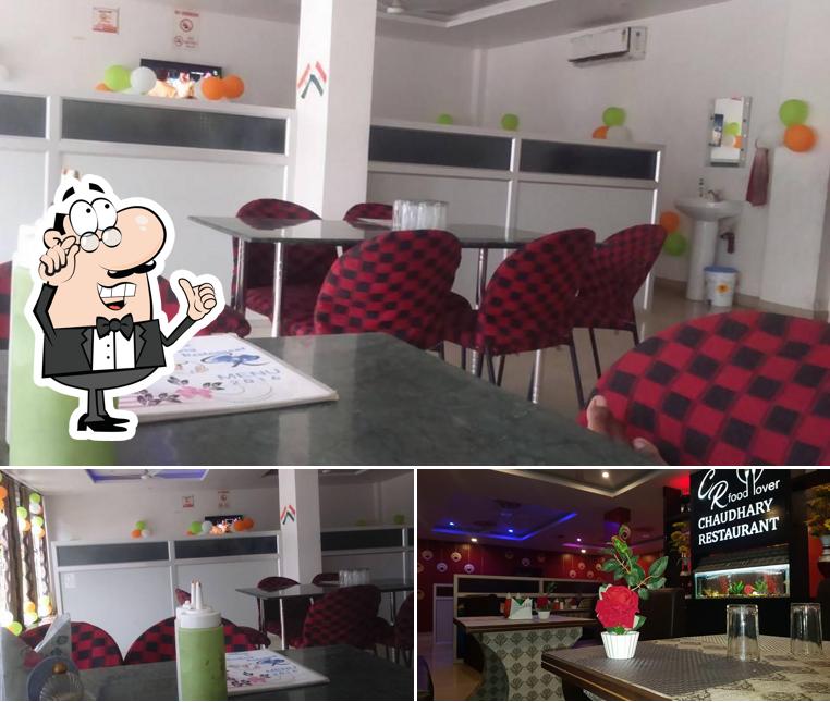 Take a seat at one of the tables at Chaudhary Restaurant