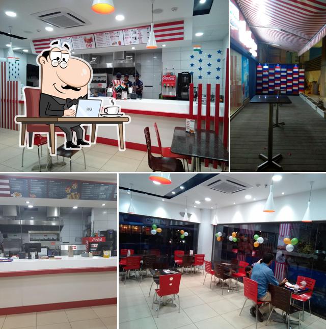 Take a seat at one of the tables at La Americana Burgers