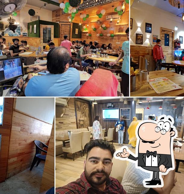 Take a seat at one of the tables at New chaudhary Dhaba