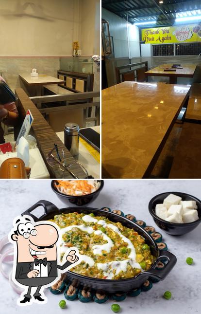 The photo of Hotel Sai Leela’s interior and pizza