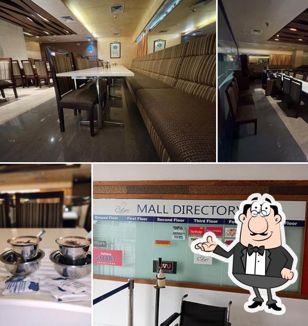 Take a seat at one of the tables at Sankalp Restaurant - South Indian Restaurant