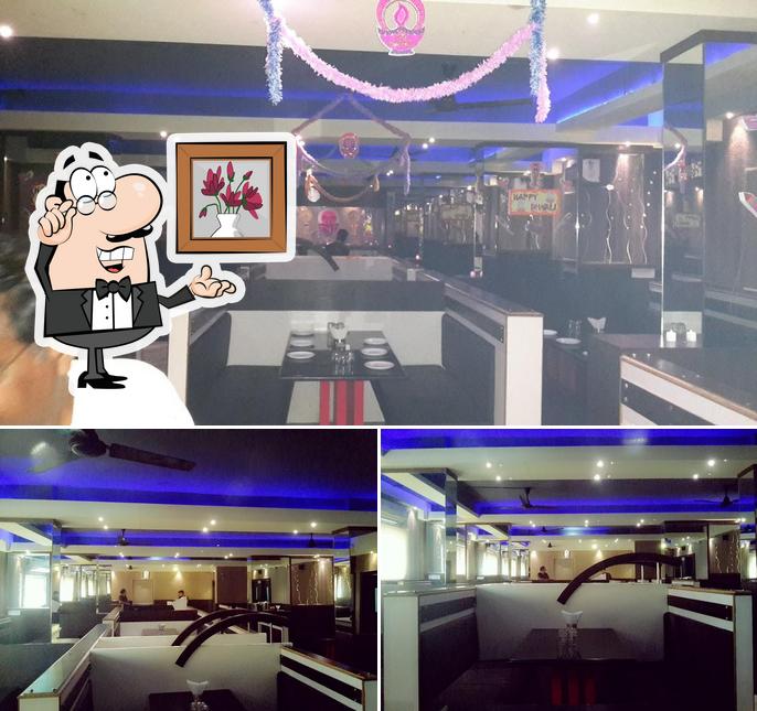 Take a seat at one of the tables at Sagar Restaurant