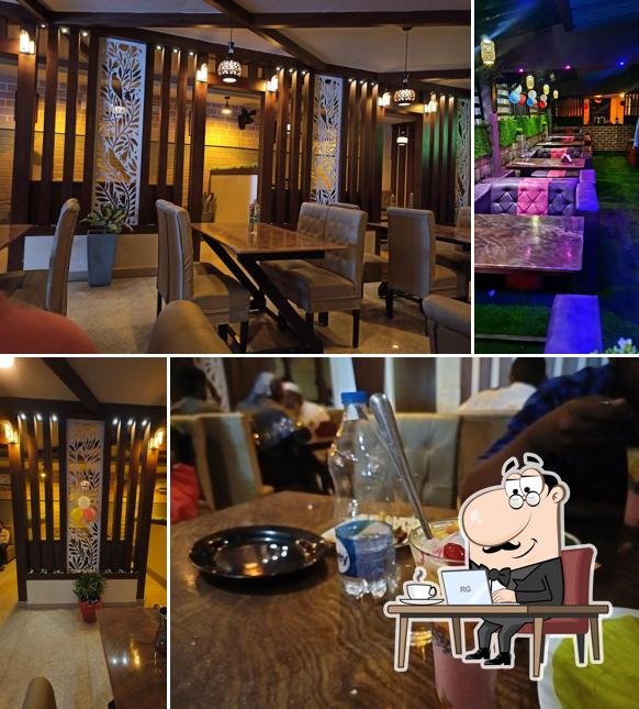 Take a seat at one of the tables at Taj Restaurant