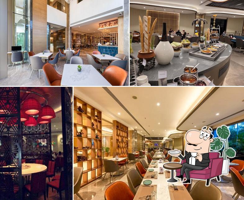 Take a seat at one of the tables at ASTER - MULTI-CUISINE RESTAURANT