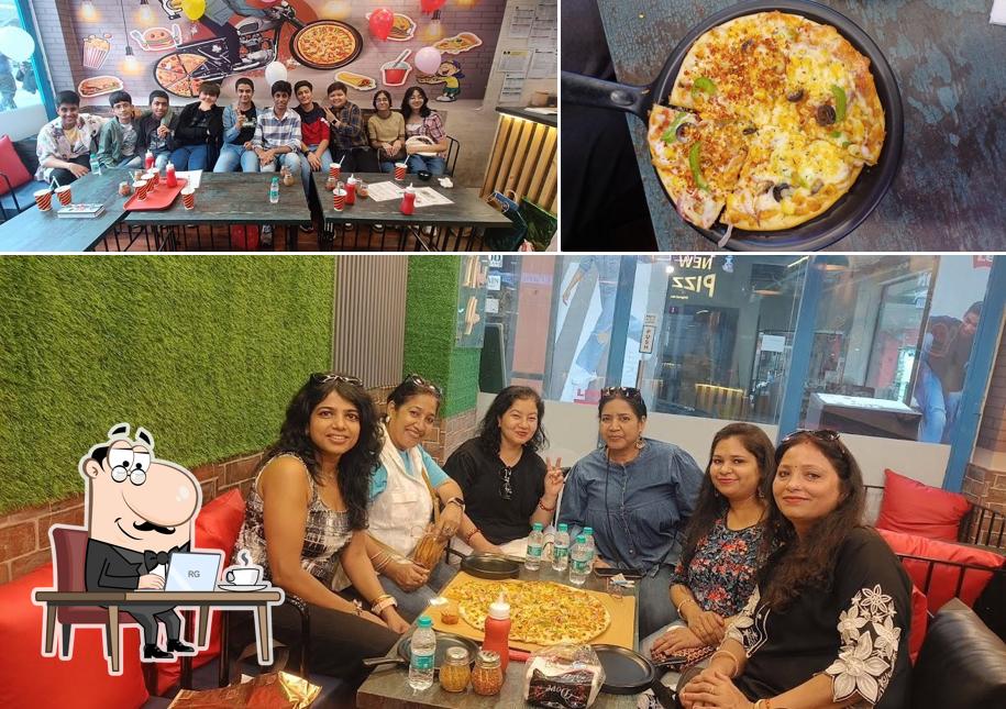 The photo of interior and food at New New york pizzeria _ best pizza restaurant in indrapuram