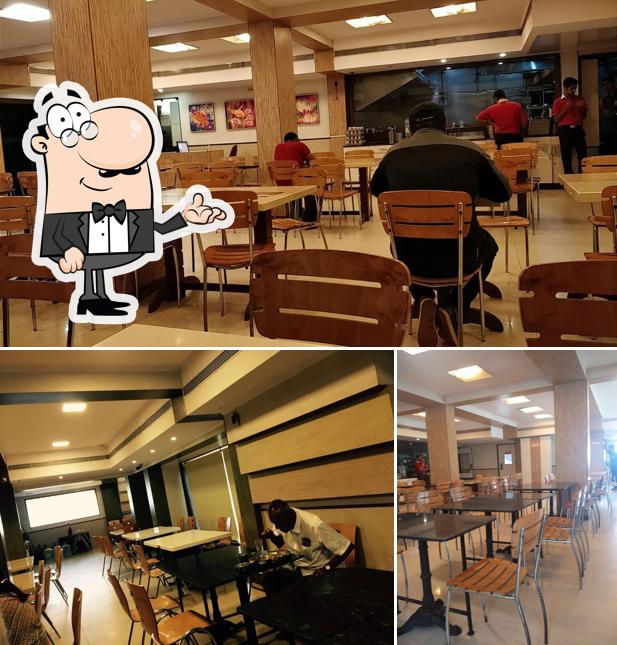 Take a seat at one of the tables at Maiyas Beverages And Foods Private Limited