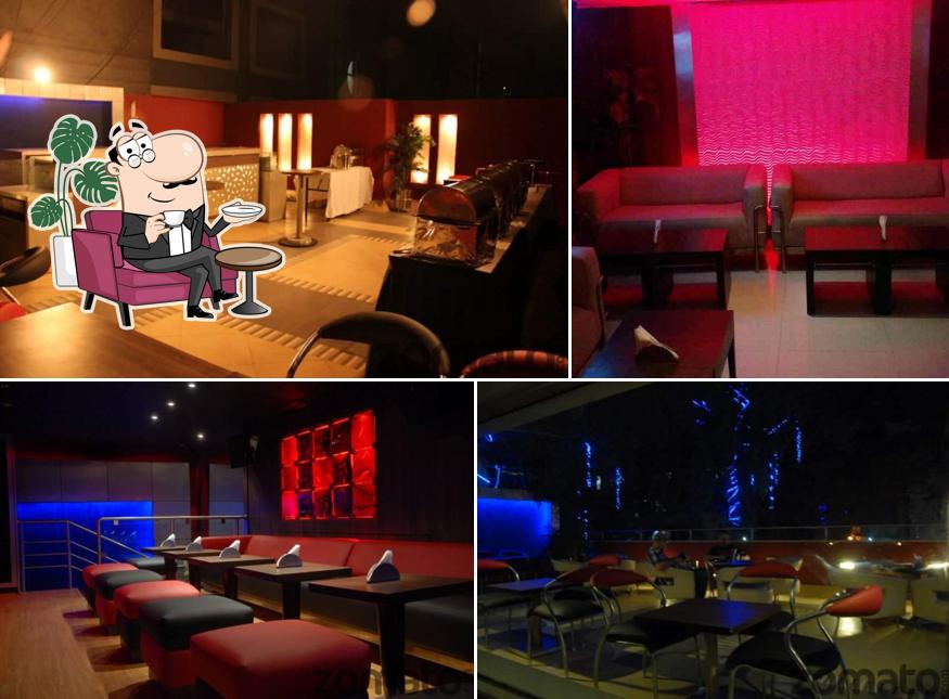 Take a seat at one of the tables at H2O - The Liquid Lounge