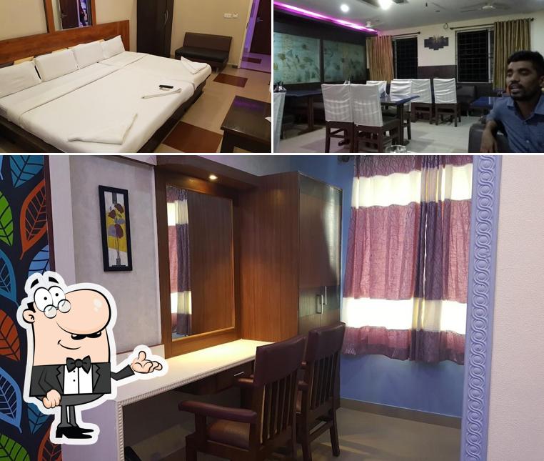 Take a seat at one of the tables at Vaishali Comforts