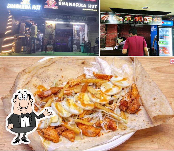 The picture of Chicken Shawarma Hut’s interior and food