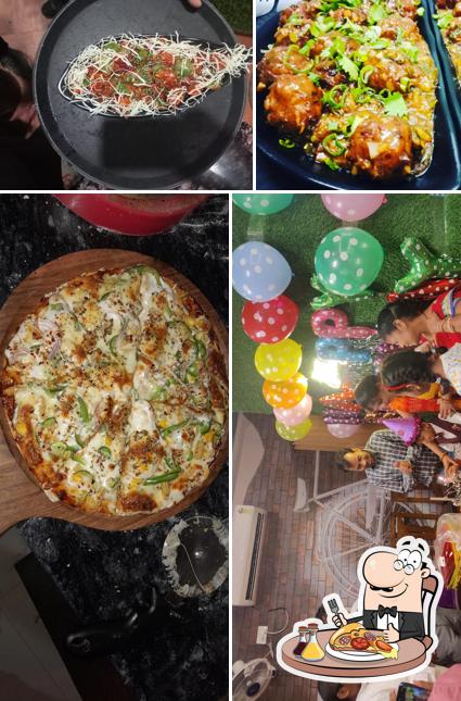 Pick pizza at UGI'S Garam Masala Restaurant