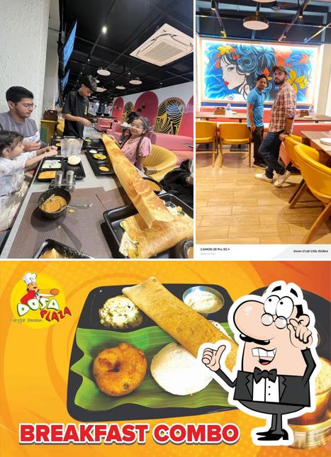This is the picture showing interior and food at Dosa Plaza Budaun (Pure Veg)