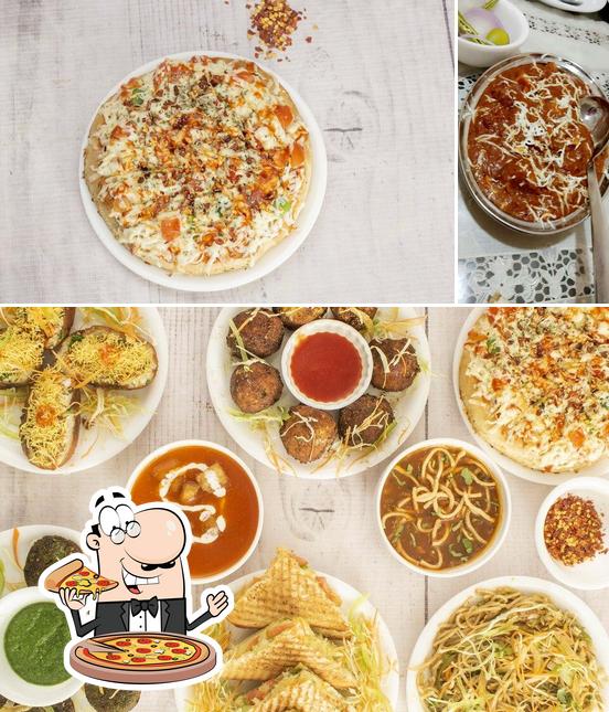 Pick pizza at All India Restaurant - Hotel Madhuban