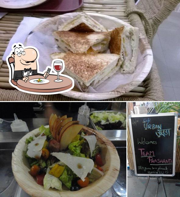 The image of Cafe Urban Adda’s food and blackboard