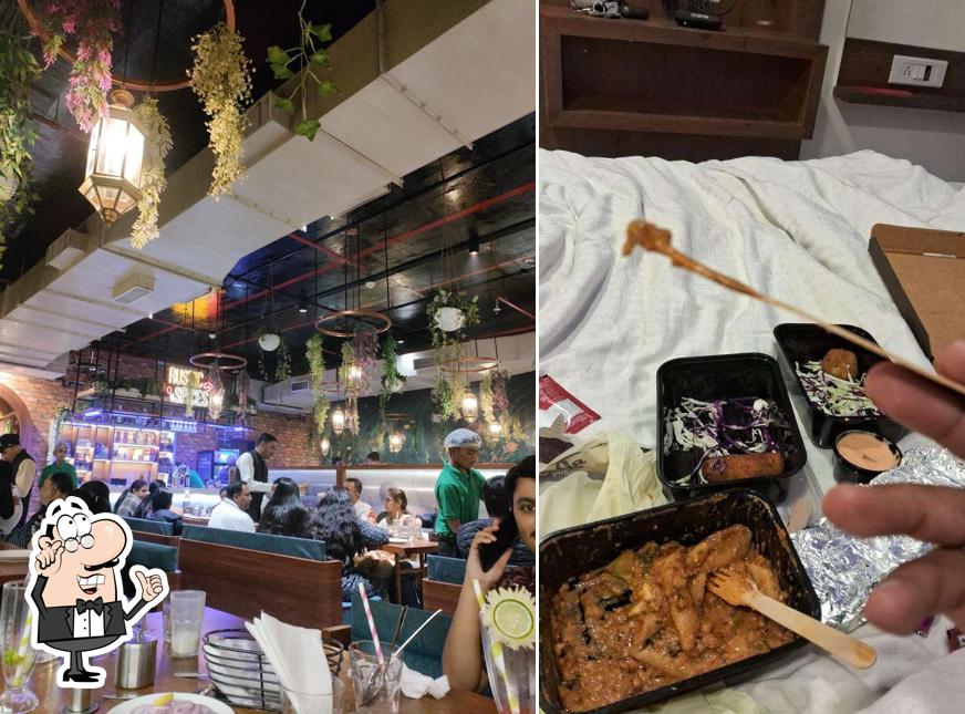 Take a seat at one of the tables at Rustic Spices Cafe and Restaurant