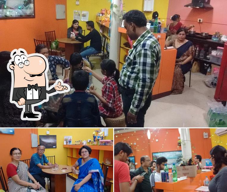 Take a seat at one of the tables at Leaves 'n Aroma (The Tea Boutique)