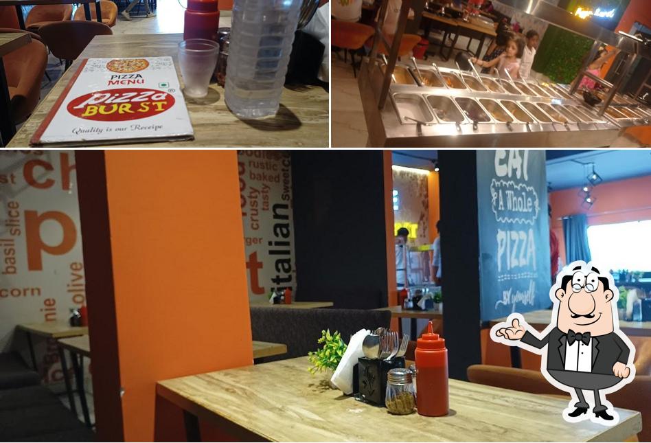 The photo of Pizza Burst Shalamar’s interior and food