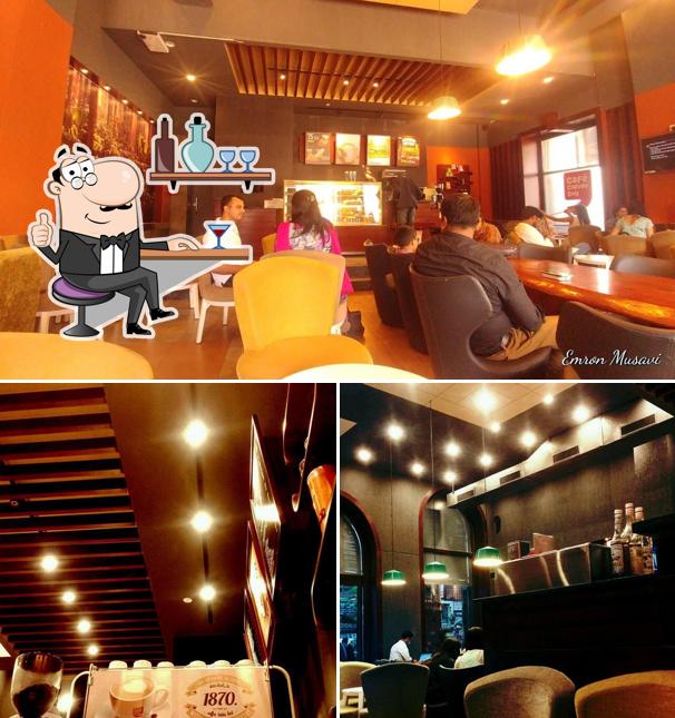 Take a seat at one of the tables at Cafe Coffee Day