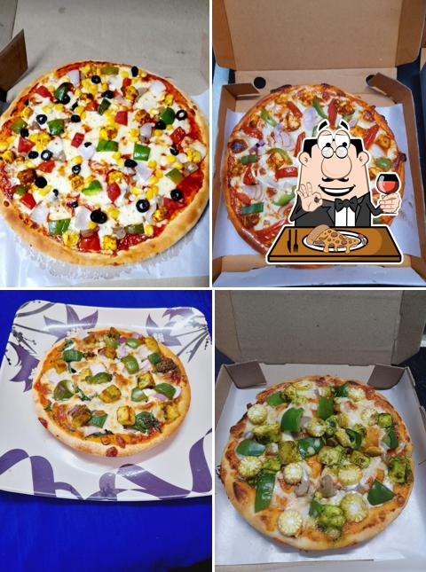 Try out pizza at POPULAR PIZZA HOME