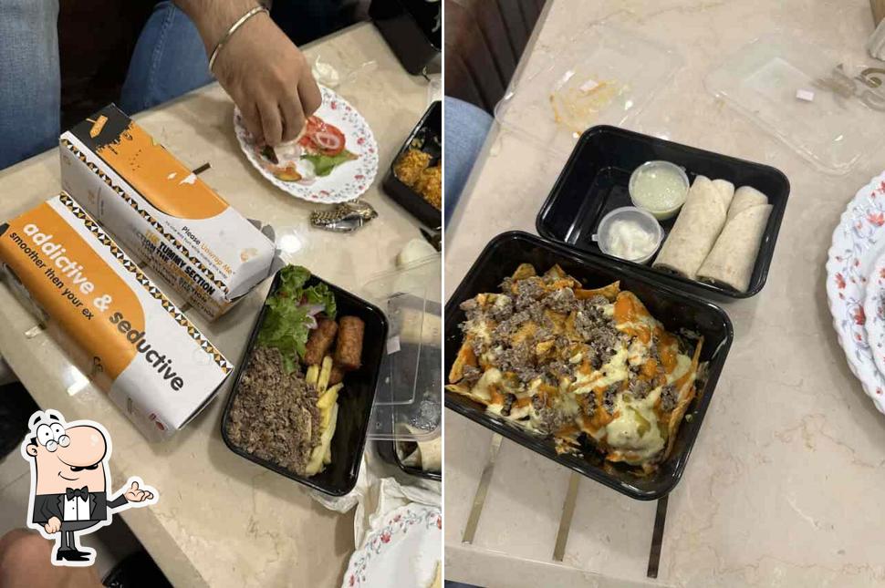 This is the picture displaying interior and food at The Tummy Section (House of Shawario)