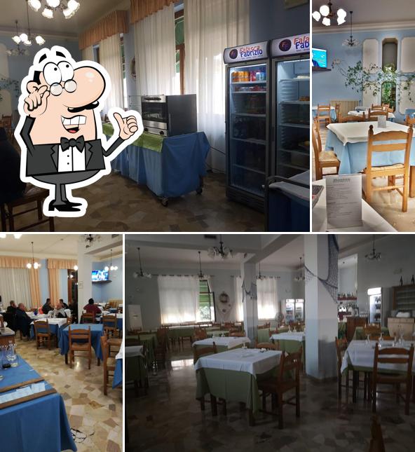 Siediti a un tavolo di Motel Ristorante Boston