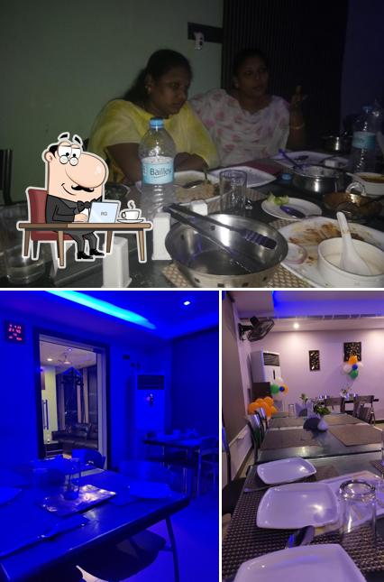 The picture of interior and dining table at Satvika Multicuisine Restaurant