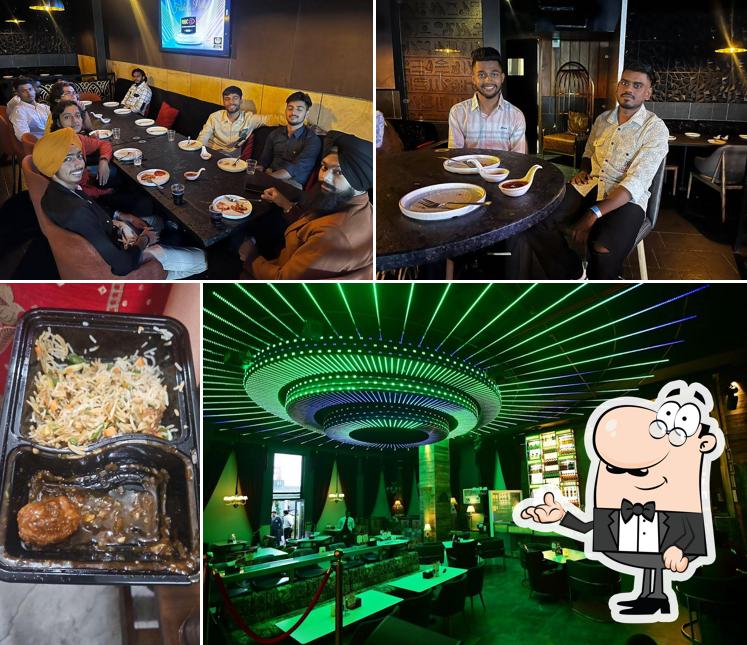 Take a seat at one of the tables at Pyramid Ludhiana Cafe Lounge Bar Microbrewery Nightclub Sky bar Restaurant