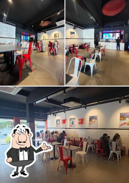 Take a seat at one of the tables at bangalore Juicy & foods