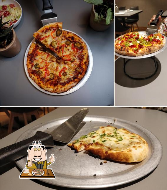 Get pizza at Pizza'hhoy Western style Pizza