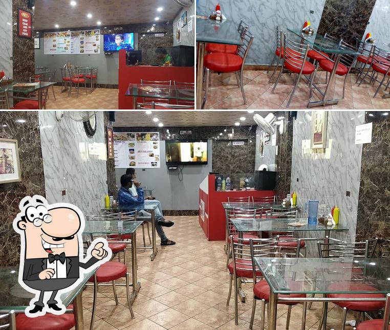 Take a seat at one of the tables at THE PIZZA CASTLE