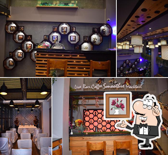 Take a seat at one of the tables at The Dog Villa Café BEST PET FRIENDLY CAFE BEST PARTY PLACE BEST CAFE IN SILIGURI