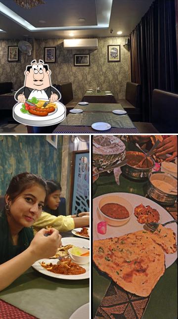 Among different things one can find food and dining table at Urban Tandoor