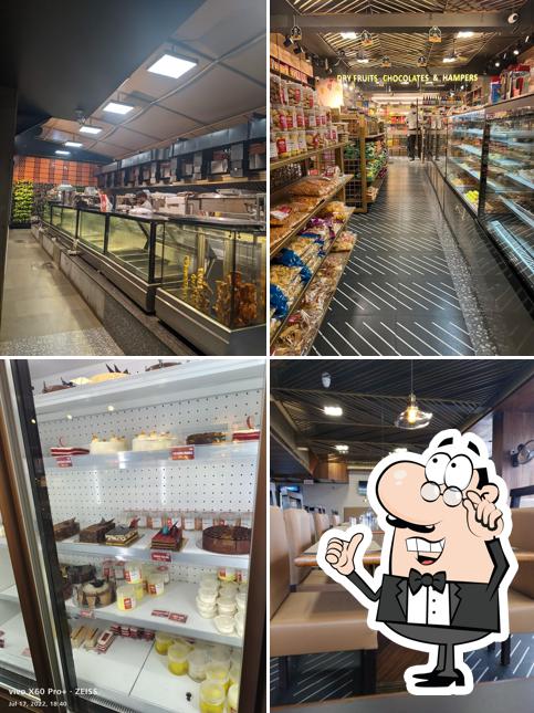 Take a seat at one of the tables at MRA Restaurant,Bakery & Cafe