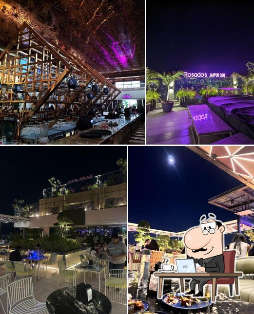 Take a seat at one of the tables at Rosado - Luxury Lounge & Kitchen