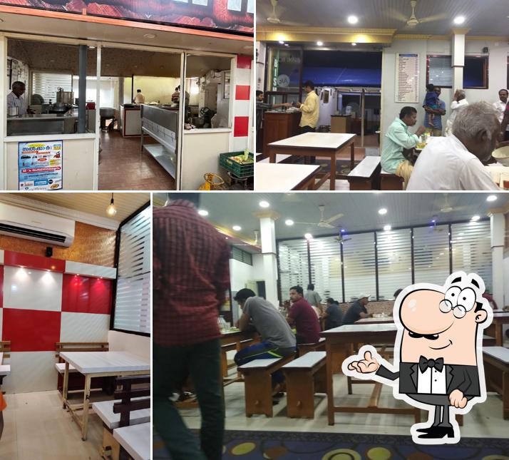 Take a seat at one of the tables at Bismi Hotel