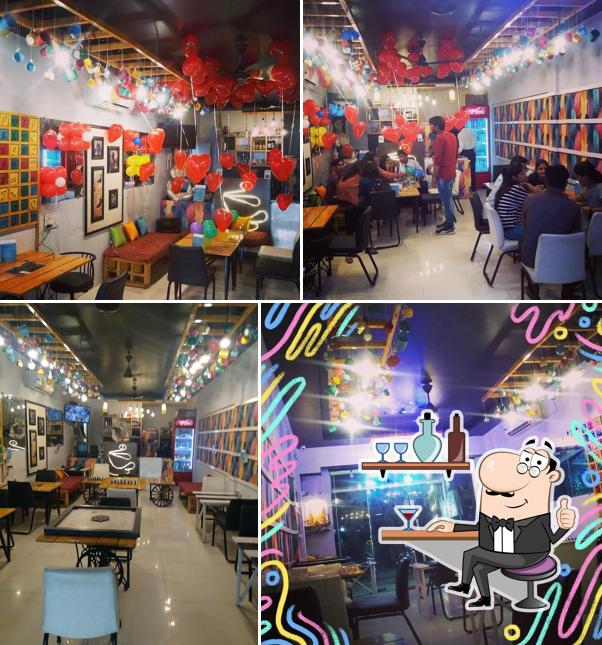 Take a seat at one of the tables at Jayakruti Cafe