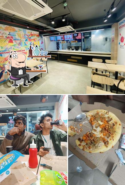 Among various things one can find interior and food at Domino's Pizza Mansarover Garden, New Delhi