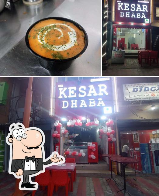 Take a look at the photo depicting interior and food at THE KESAR DHABA