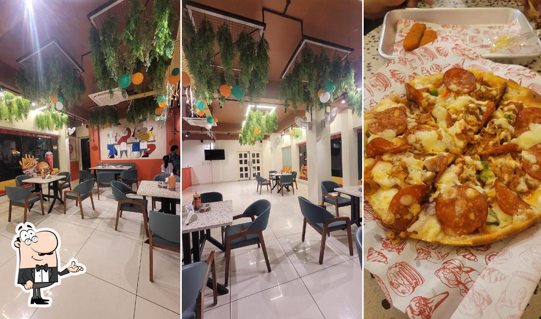 Take a seat at one of the tables at Burger khan