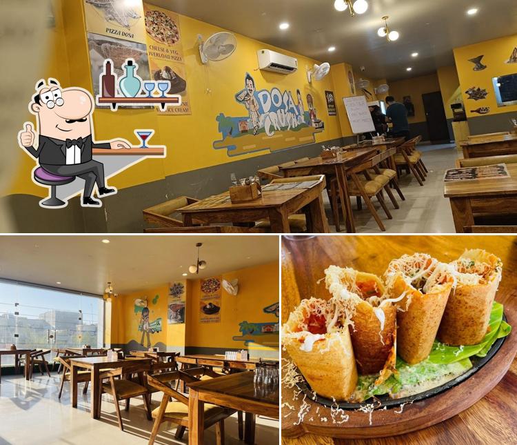 Take a seat at one of the tables at Dosa Crush Best Dosa in Jaipur