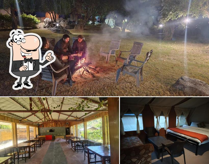 Take a seat at one of the tables at Rill And River Luxury Camp Riverside Resort