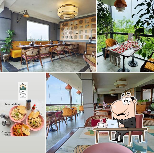 Take a seat at one of the tables at Windsong cafe ৱিন্ড চং ক্যেফে