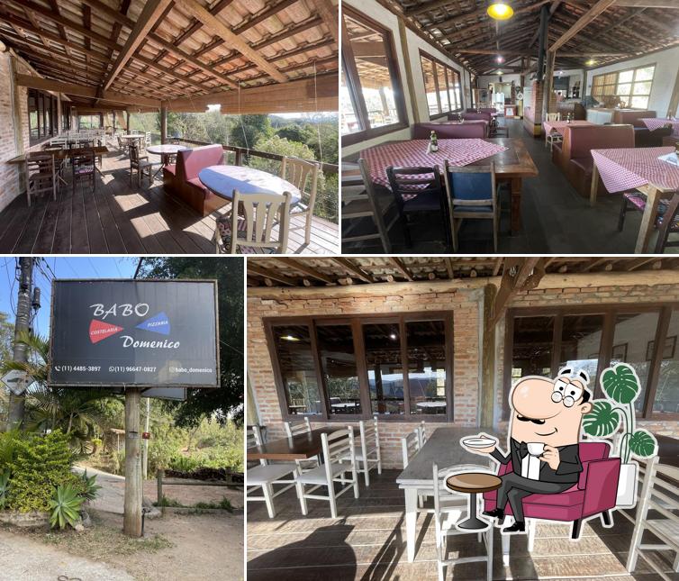 Sente em uma das mesas no Babo Domenico Pizzaria e Costelaria
