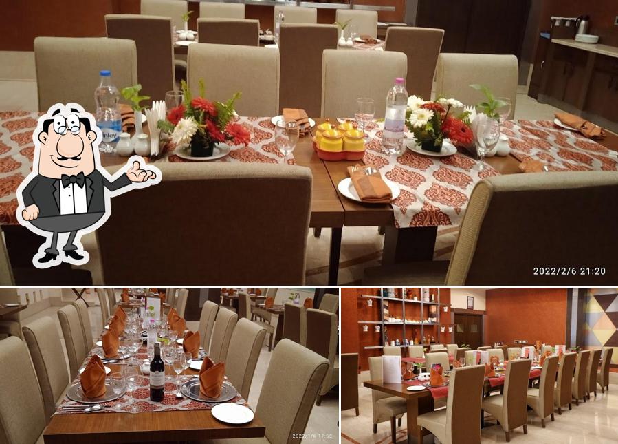 Take a seat at one of the tables at Punjab Restaurant