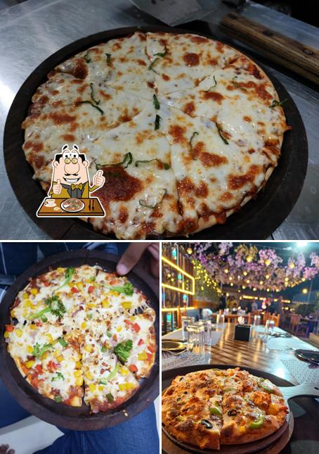 Pick pizza at Venus Rooftop Restro & Cafe Best Rooftop Cafe in Ahmedabad