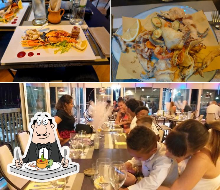 Guarda la foto che presenta la cibo e interni di Ristorante Il Porticciolo