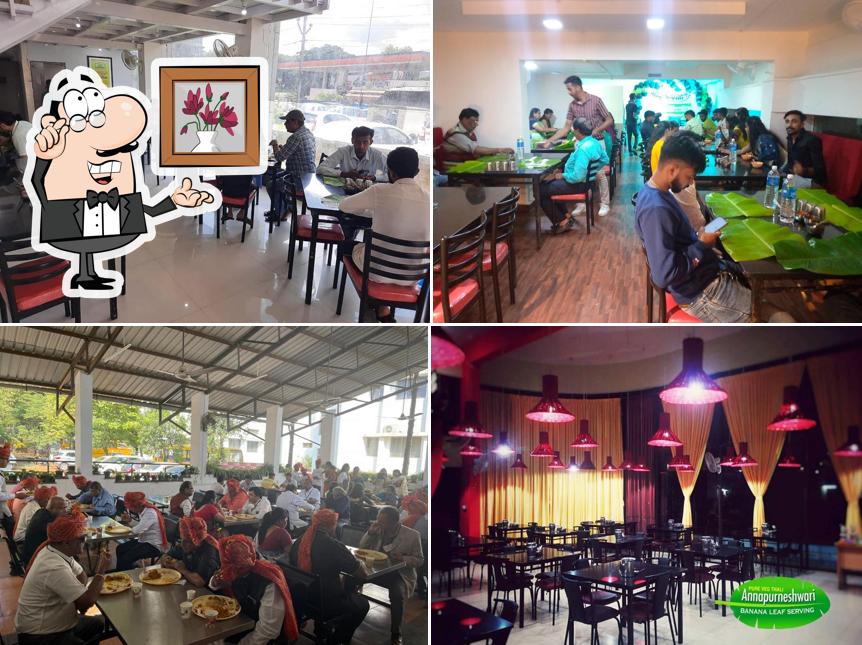 Take a seat at one of the tables at Annapurneshwari Thali Restaurant, Ayodhyanagar