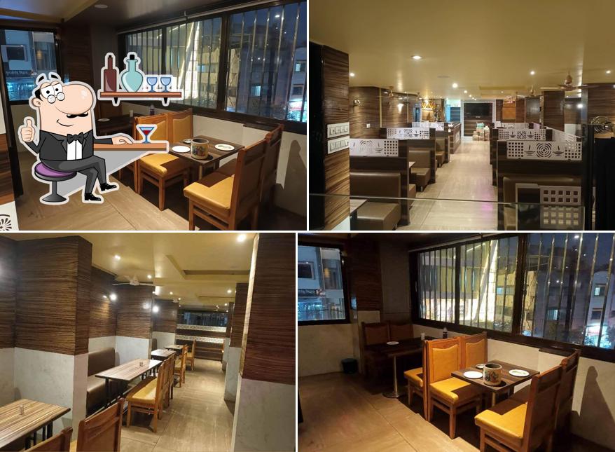 Take a seat at one of the tables at Banjara Bar & Restaurant