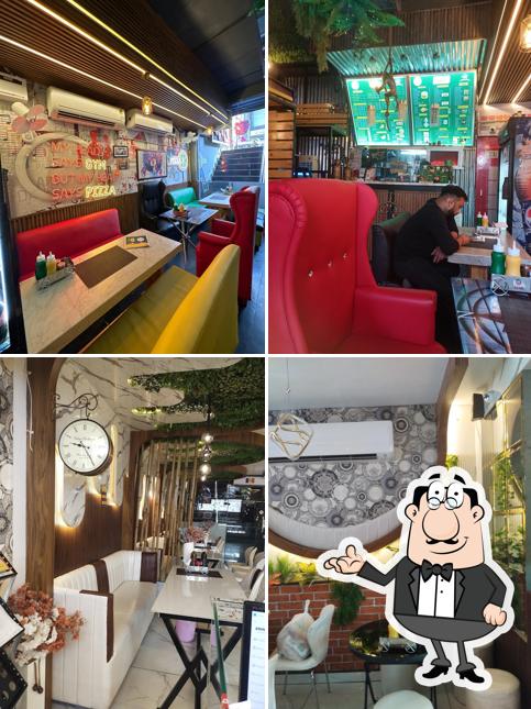 Take a seat at one of the tables at Bolton Pizza & Burger