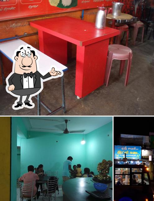 Take a seat at one of the tables at Hotel Sri Sabari Idly Kada